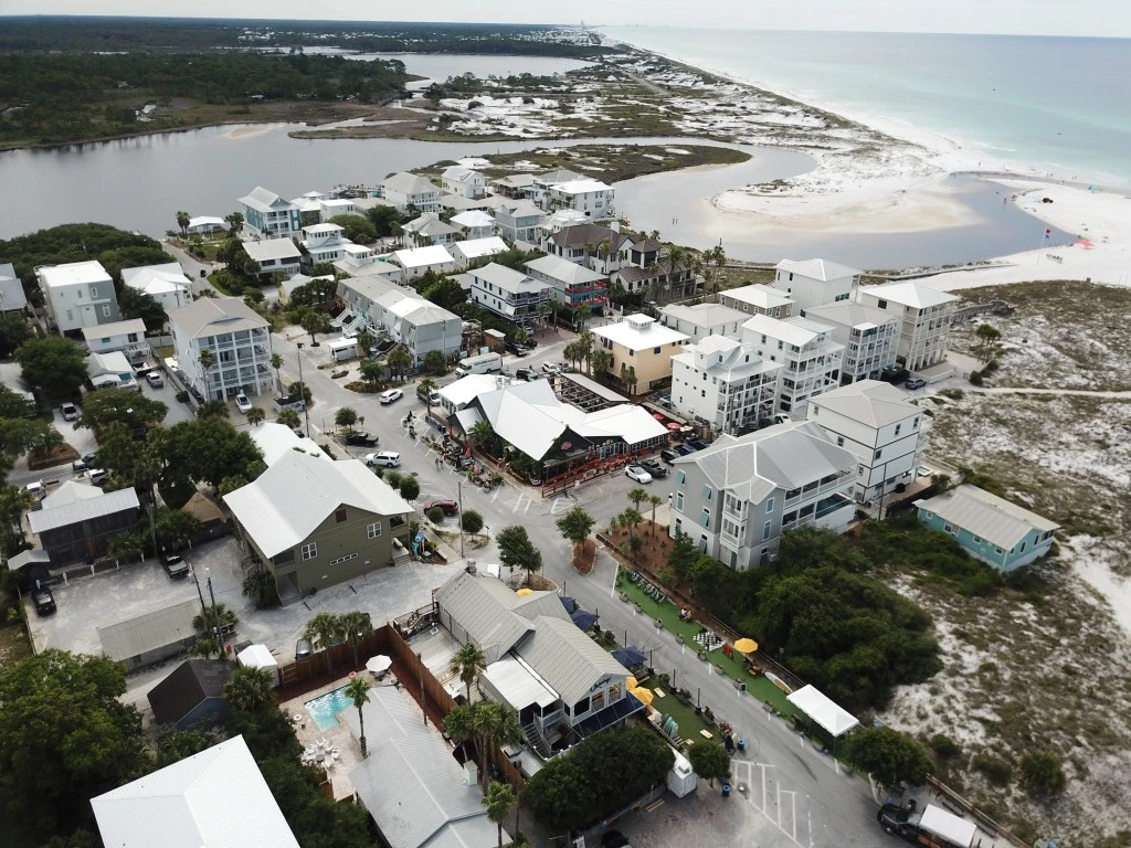 Aerial view of Grayton Beach homes, the Gulf, and a coastal dune lake