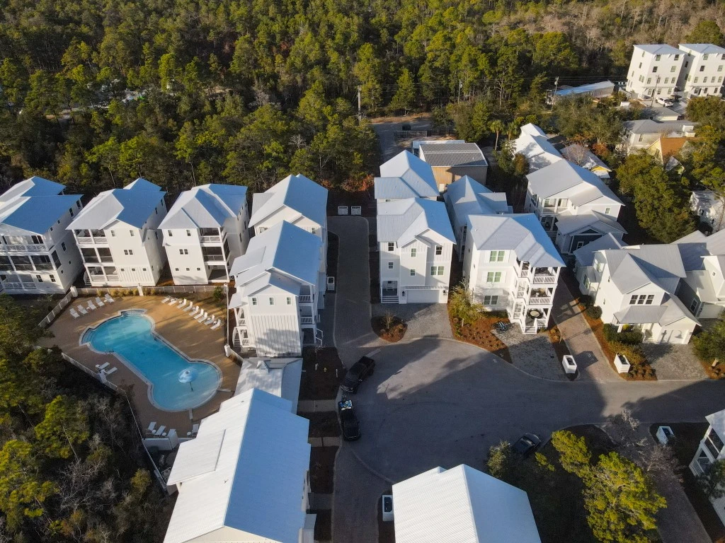 Aerial view of Village at Grayton Beach homes surrounded by pine forest